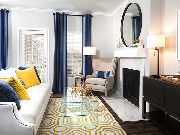Fireplace with modern mantle and Carrara-style tile surround available