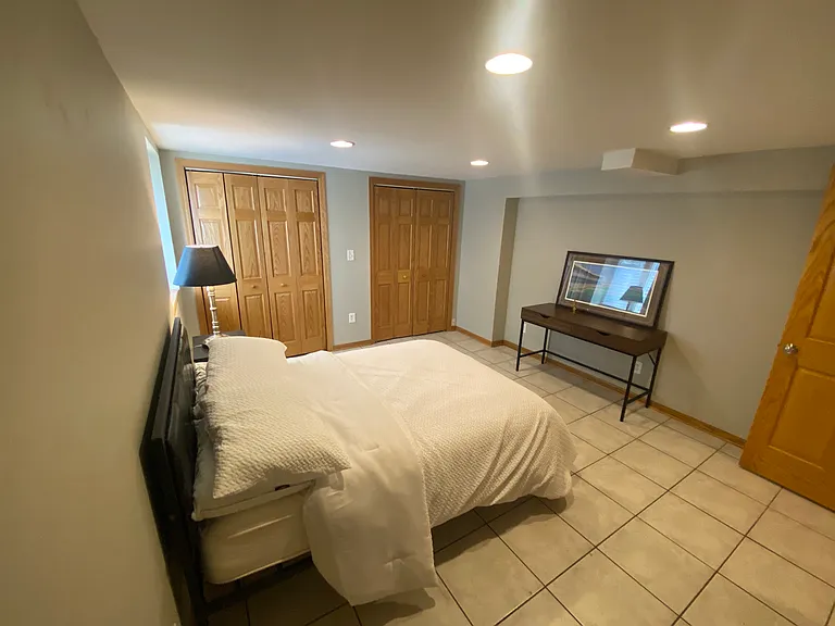 Roomy basement bedroom with 2 storage closets.