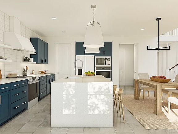 Kitchen with waterfall island and pendant lighting