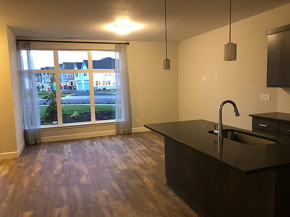 Living room- Large window with view, open layout kitchen