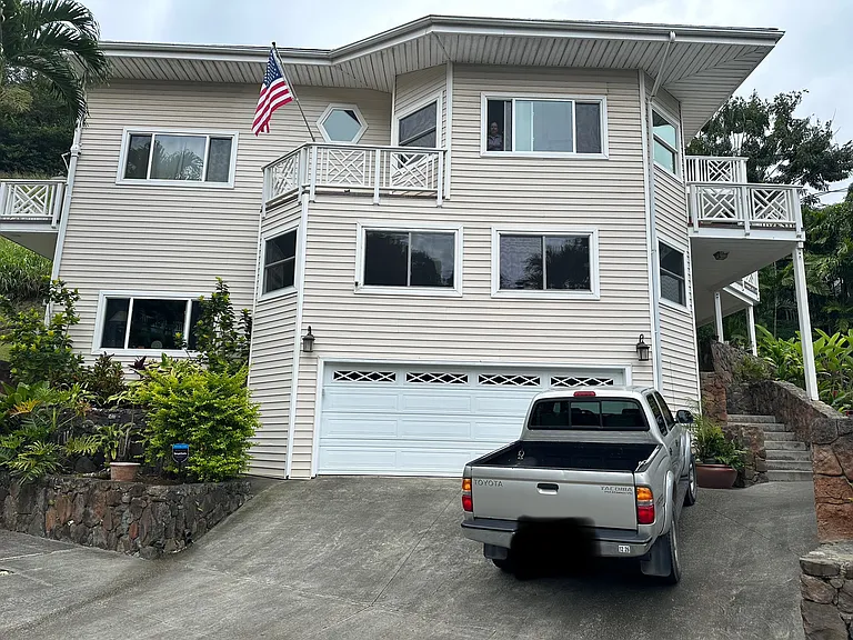 Private apartment entry to the right of the truck up the steps. Tenant dedicated parking space in the spot where the truck is located. Located at the end of the cul-de-sac up the hill.
