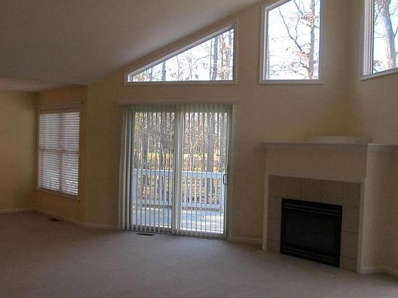 Living Rm with gas fireplace, amazing windows