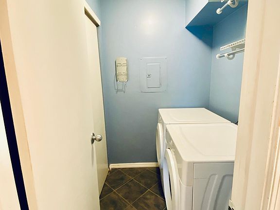 Washer & Dryer and lots of shelfs for storage.
