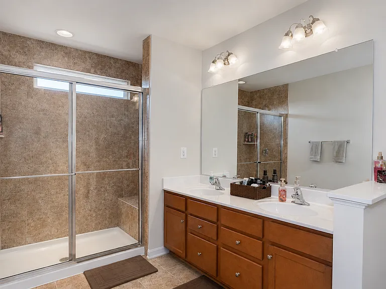 Spacious Primary Bathroom with Dual Sinks and Walk-In Shower