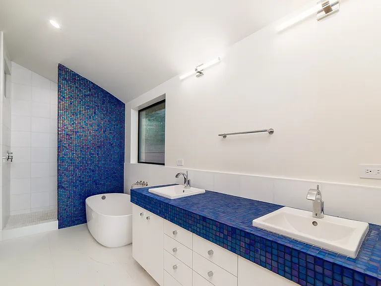 Marble and Oceanside glass in master bath with standing soaker tub