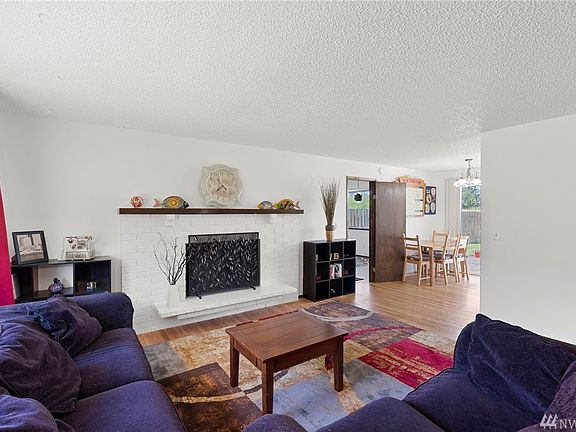 Cozy up next to the fireplace with a good book and enjoy the view from the glass slider out to the private rear yard of unit 4221