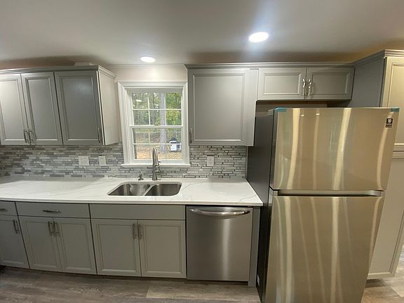 Brand New Everything in Kitchen (Stainless Steel Refrigerator/Freezer, Stainless Steel Dishwasher, Stainless Steel Oven & Microwave, Double Sink with New Window, Brand new Granite Counter Tops and Brand New Grey Cabinets) with recessed lighting throughout