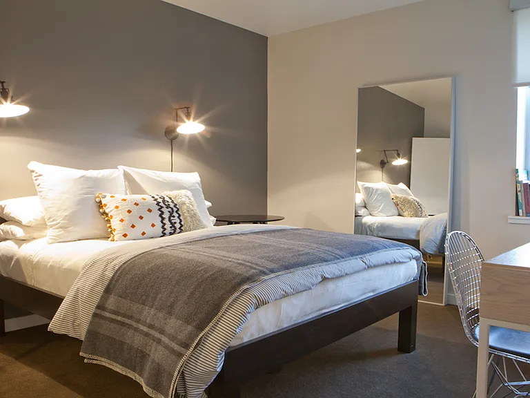 Cozy bedroom with wall-to-wall carpeting