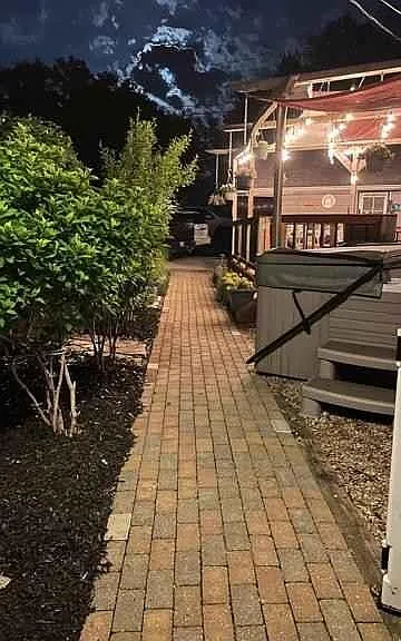 Walkway to deck, jacuzzi and garage