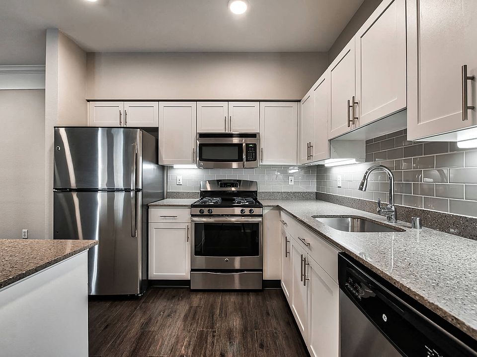Renovated kitchens with quartz counters and stainless steel appliances