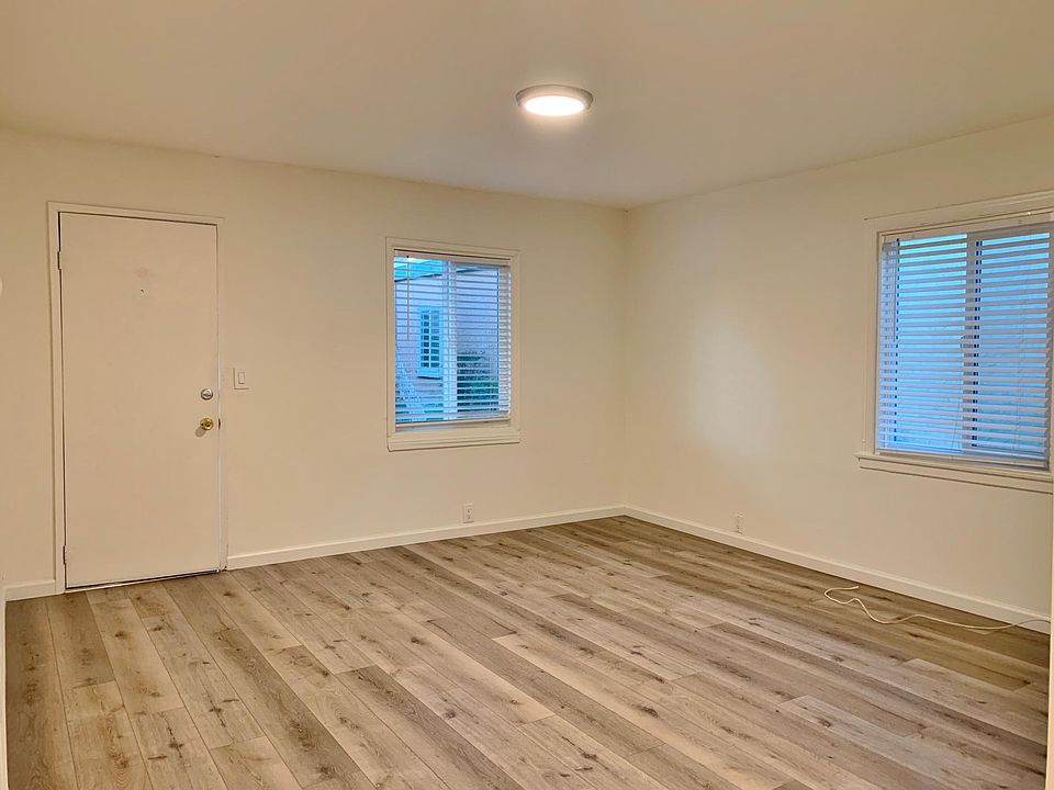 Living Room; stock photos. Available unit has luxury vinyl "wood" plank flooring throughout except in the bathroom.