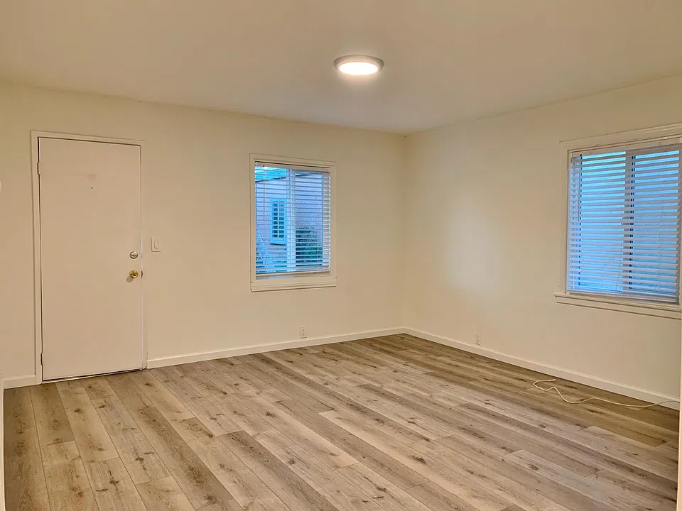 Living Room; stock photos. Available unit has luxury vinyl "wood" plank flooring throughout except in the bathroom.