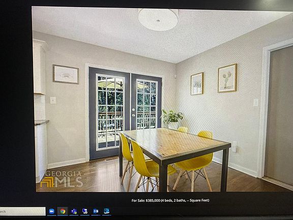 Plenty of room for dining , open up the doors to back deck for grilling