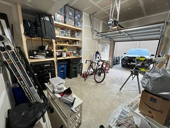 Single car garage with drive way, built in shelving, two remotes garage opener and external key pad