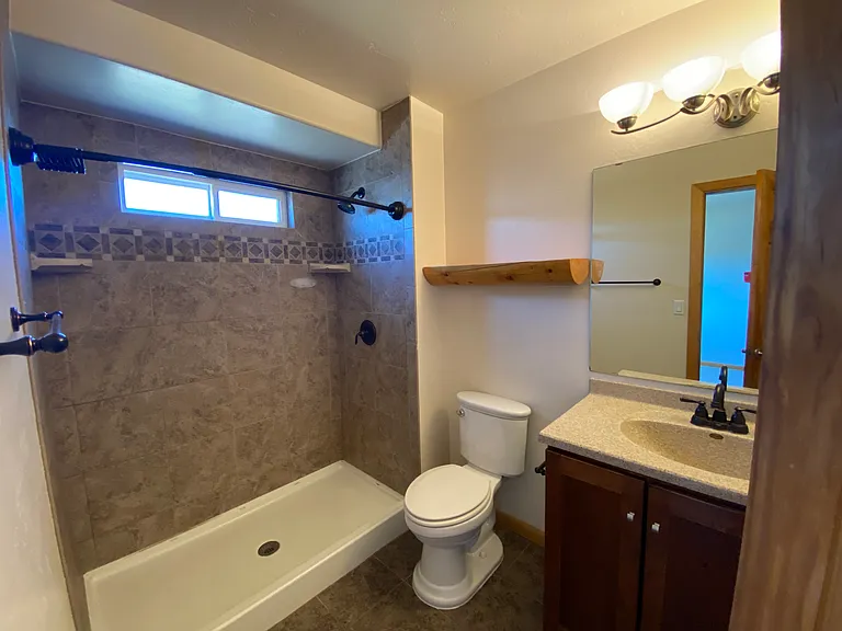 Private attached bathroom conveniently located off the primary bedroom.