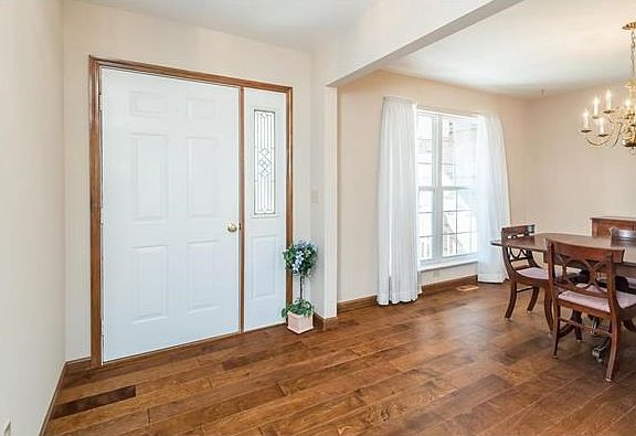 Front door and entry foyer with lots of natural lighting