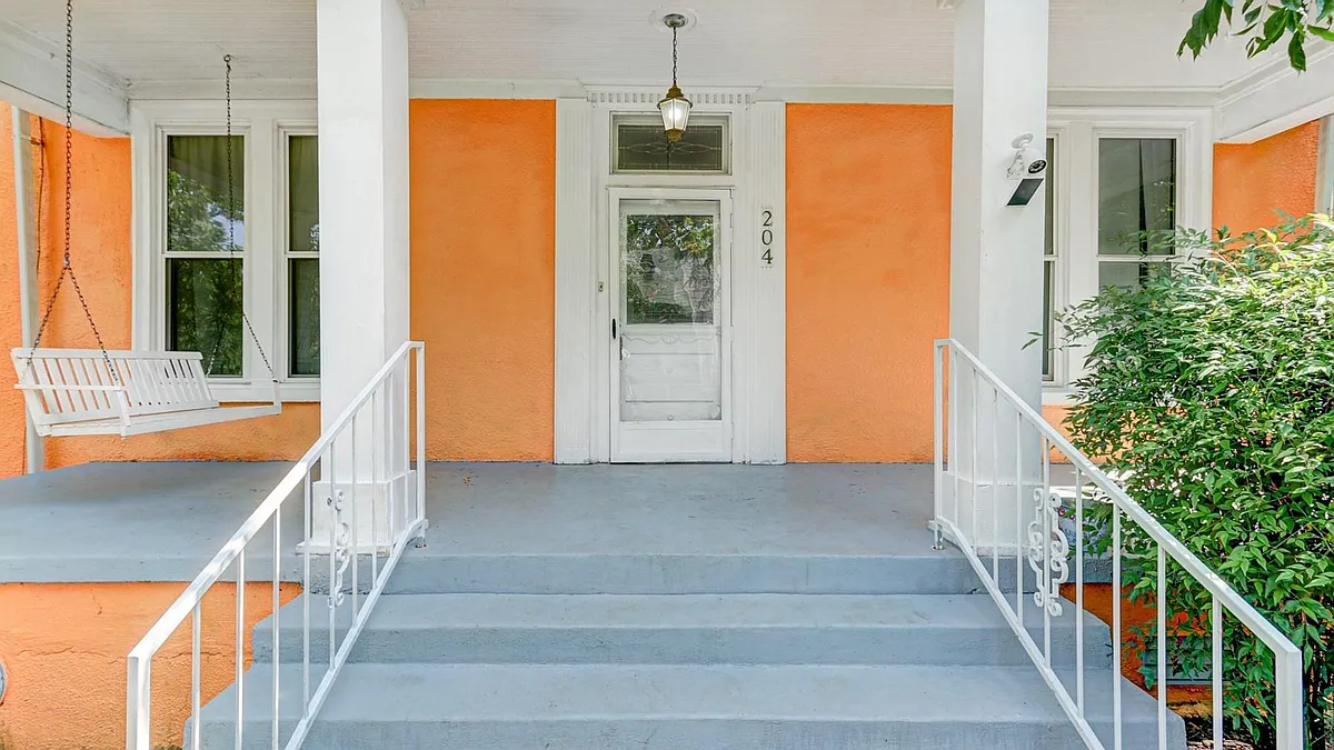 Relax on the white porch swing - 204 Barker St
