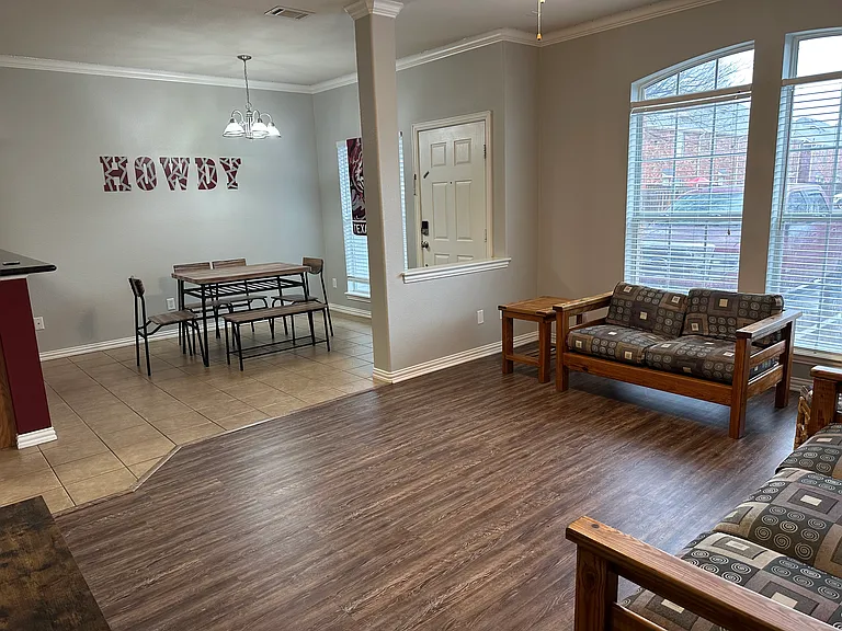 Living and dining. 6 seater dining table with a bench with shoe storage under it.