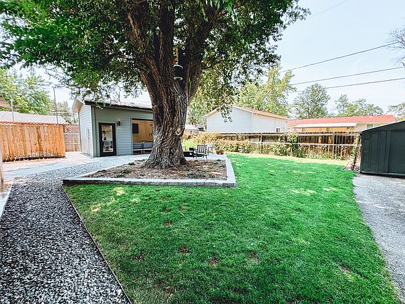 Fully fenced in backyard with south-facing area for a garden