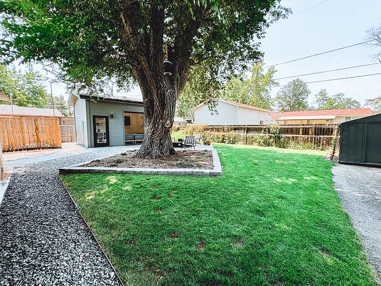 Fully fenced in backyard with south-facing area for a garden