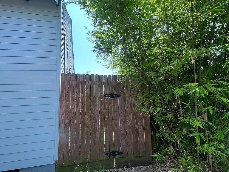 private gate to small outdoor area and back door to house