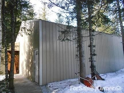 Shop/wood storage
						:
						Shop has rear entry door and outside covered wood storage area