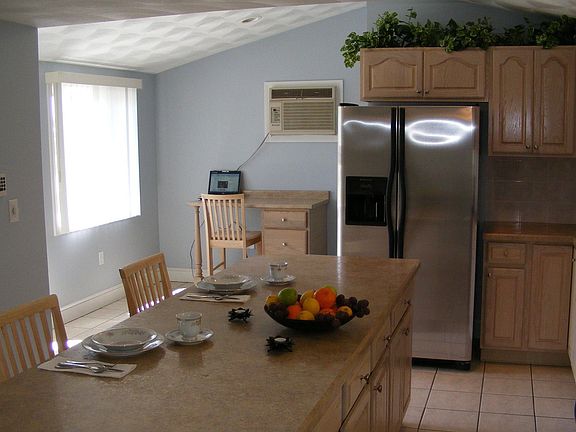 Charming kitchen includes, built in air conditioner, desk and alarm system.