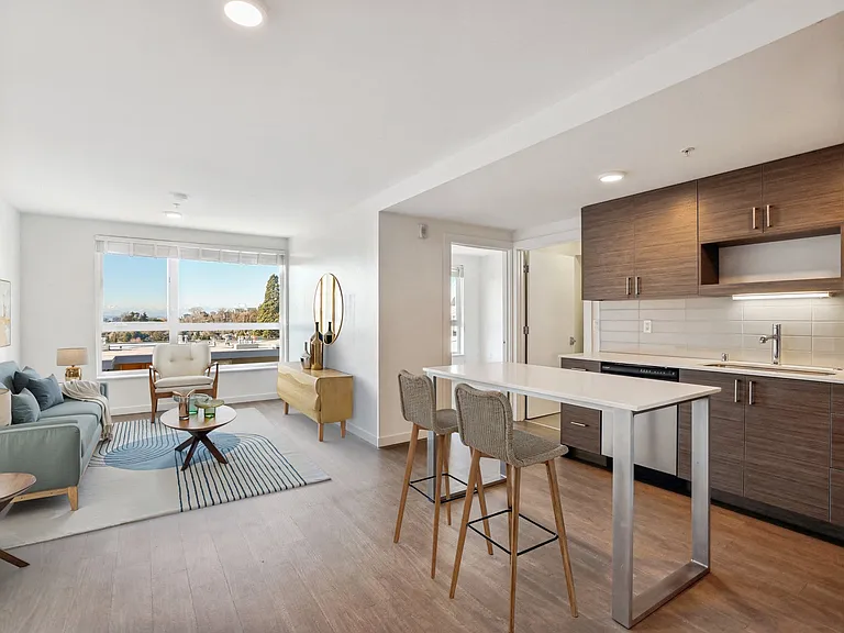 Experience modern living at 4400 Alaska in Seattle, WA. This open-concept layout features a spacious living room and a contemporary kitchen with stylish cabi...