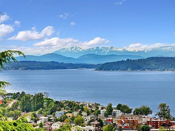 The view overlooks not only Puget Sound and the Alki beach promenade, but also the islands and of co