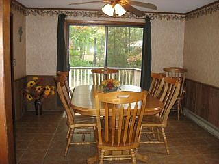 Tile dining room open to deck
