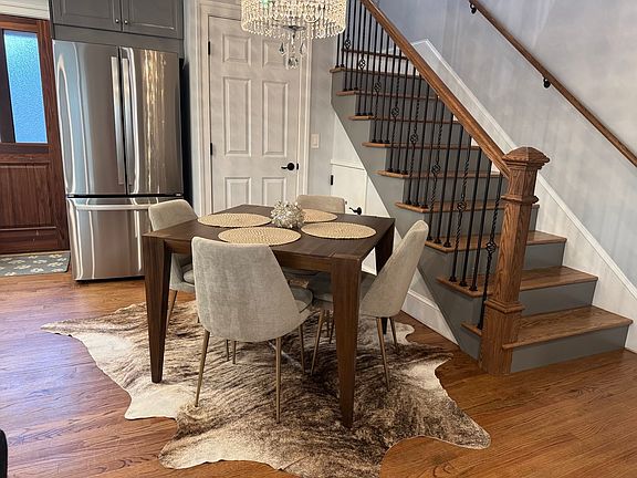 Brand new refrigerator/freezer with water dispenser and auto ice maker, access to storage under the stairs.