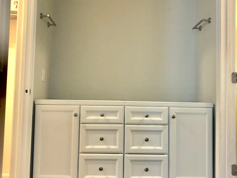 Master bath vanity with quartz countertop, adding new four piece lighting fixture and mirror.