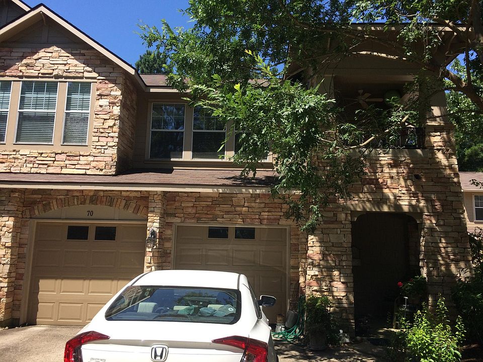 Outdoor view of unit- all windows seen here are part of this unit. To the right is the balcony patio, then the living room windows, then the dining room windows.