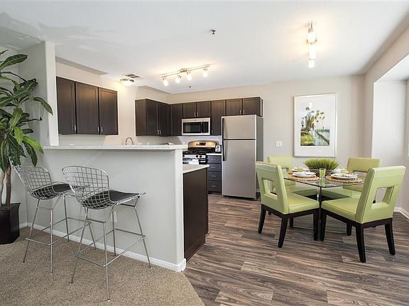 Wood-look flooring runs through the kitchen and dining nook