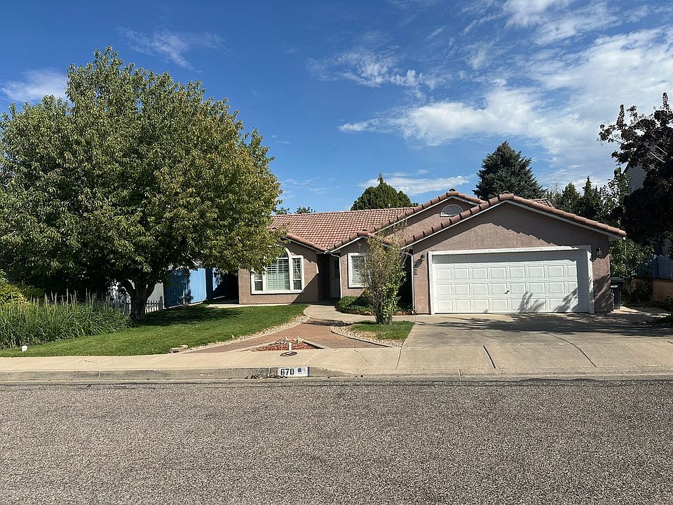 Front view from street of home and 2 car garage
