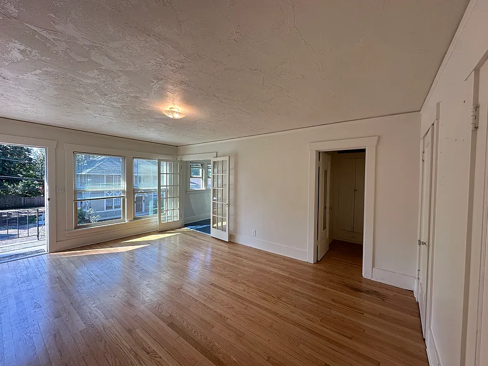 view of living space from back closet wall