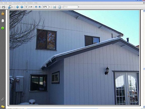 Back view of home w/addition