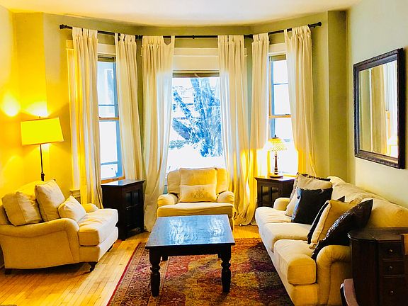Large and bright formal living with bay windows 