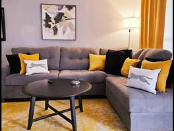 The living room has ample space for relaxing with family or gathering for the holidays