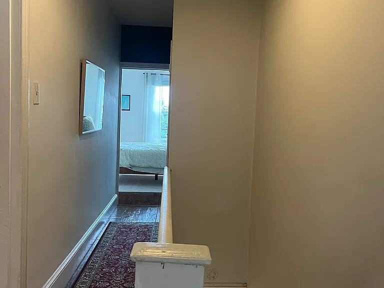 Upstairs hallway to three bedrooms and one bath