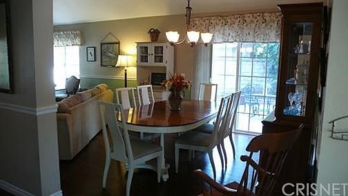 DINING LOOKING TOWARDS SIDE PATIO AREA