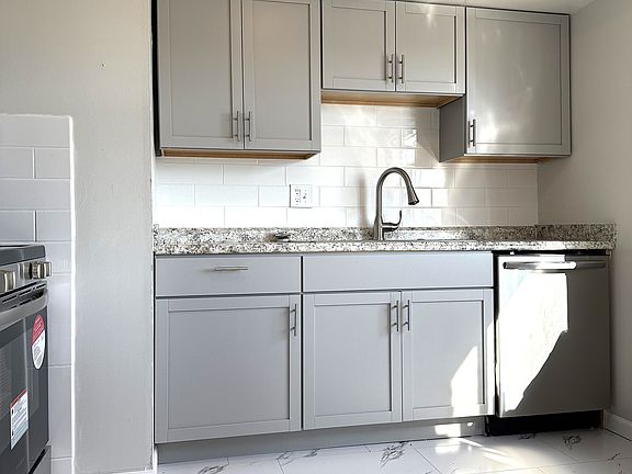 Large Kitchen - space for table 
Garbage disposal - Dishwasher