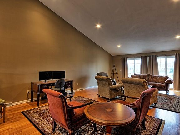 Large living space with cathedral ceilings to accomodate  formal dining if desired