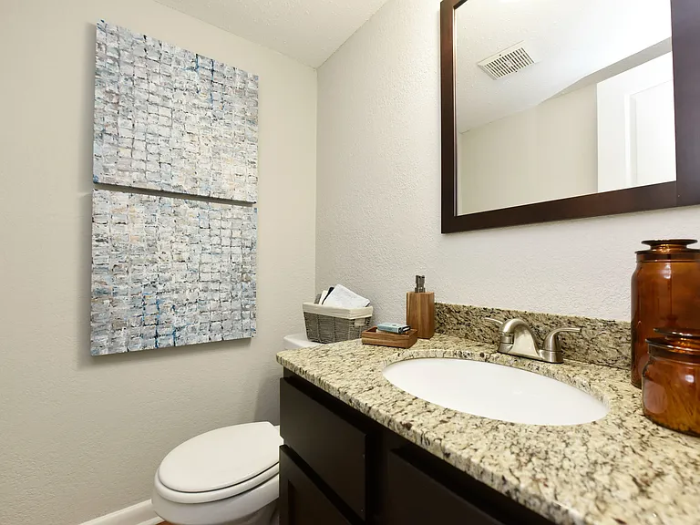 Bright bathroom with granite counters