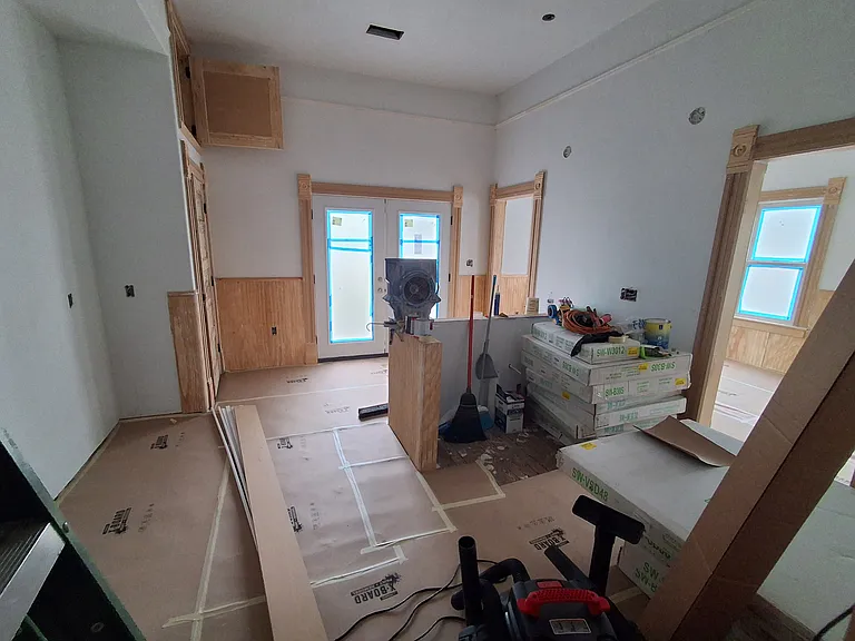 Charming beadboard to create look and feel of large country kitchen, with great dining room just off it. Laundry closet at left rear. Original floors will be restored.