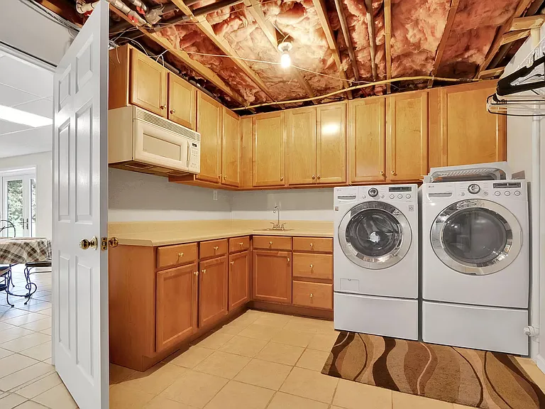Kitchenette and laundry space in basement