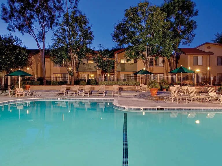 Our outdoor swimming area includes a hot tub