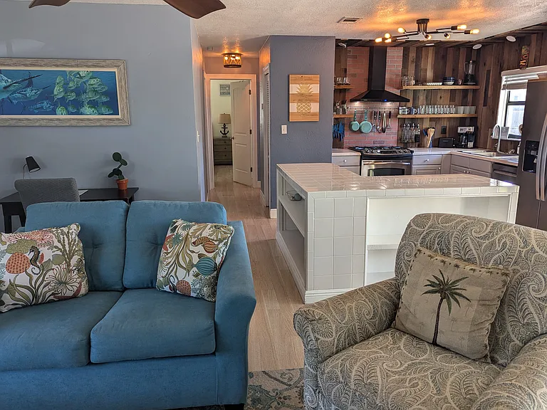 Comfortable sitting area with open access to kitchen kitchen.