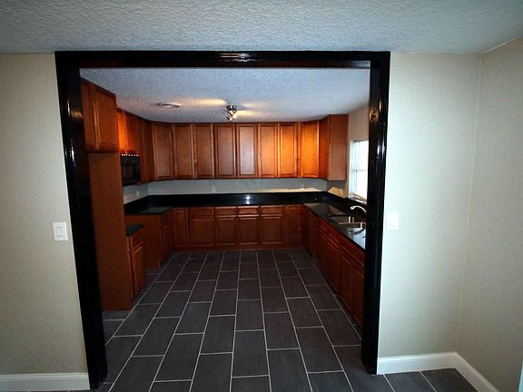 NEW KITCHEN, FLOORING, TRIMWORK, PAINT, ROOF
