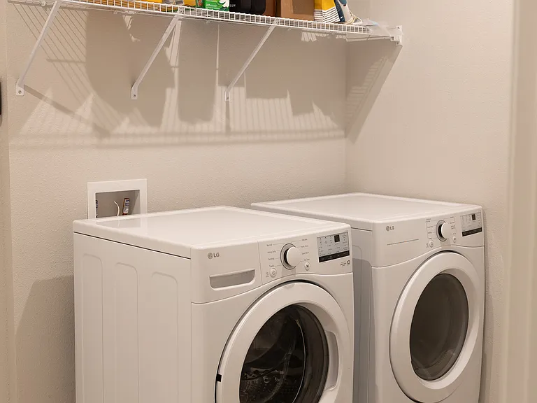 Washer + Dryer included in unit 
Storage shelves